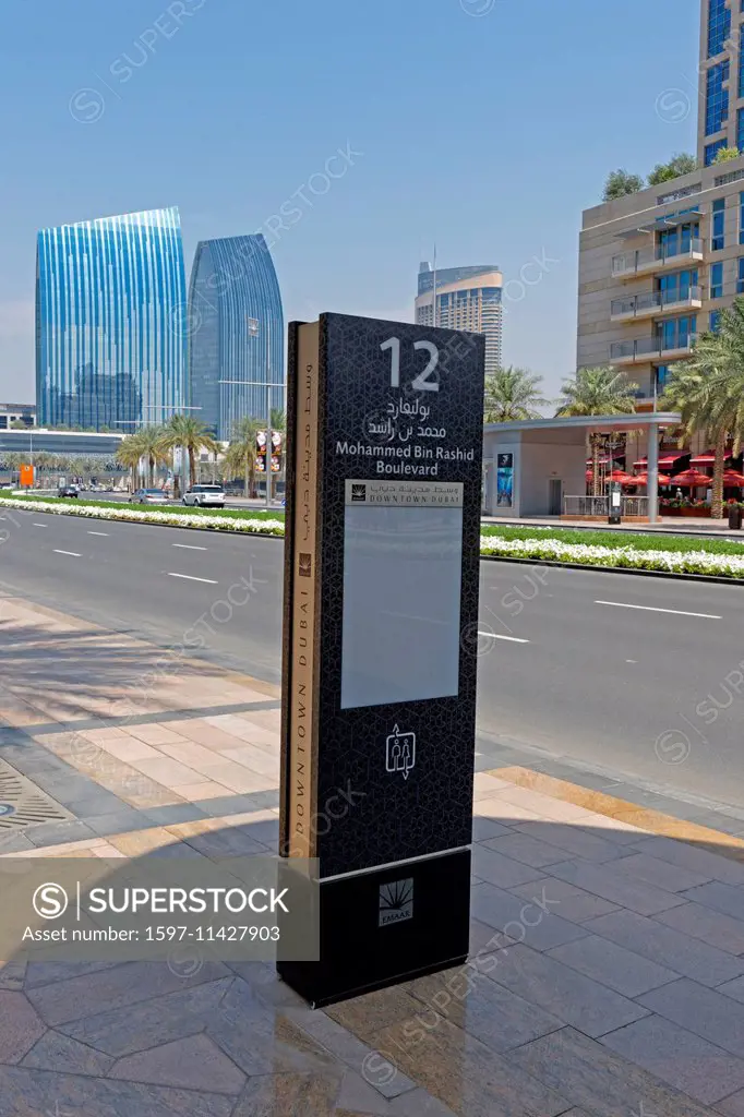 Asia, United Arab Emirates, UAE, Dubai, Sheikh Mohammed Bin Rashid boulevard, bus stop, street scene, palms, architecture, trees, buildings, construct...