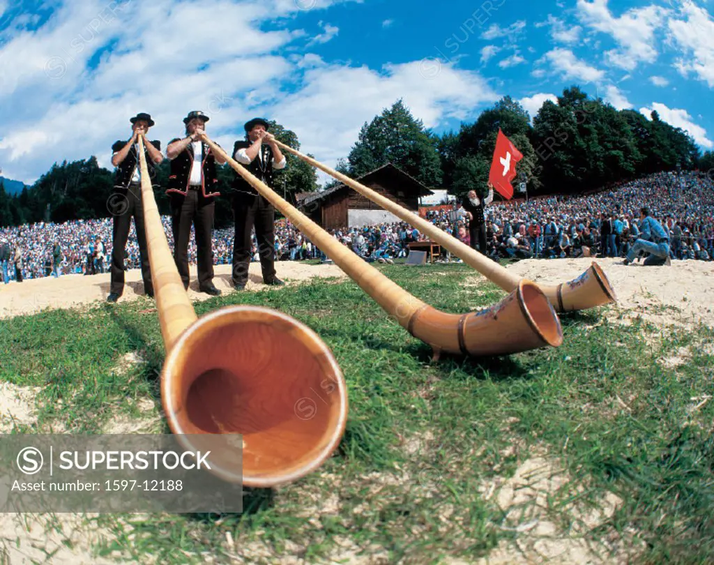 Alphorn blower, Berne, Canton Bern, festival, flag, flag thrower, folklore, Interlaken, mountains, music, musicians,