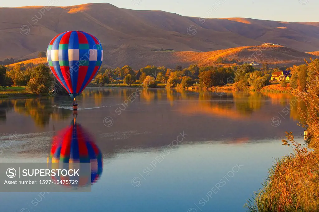 hot air balloon over lake