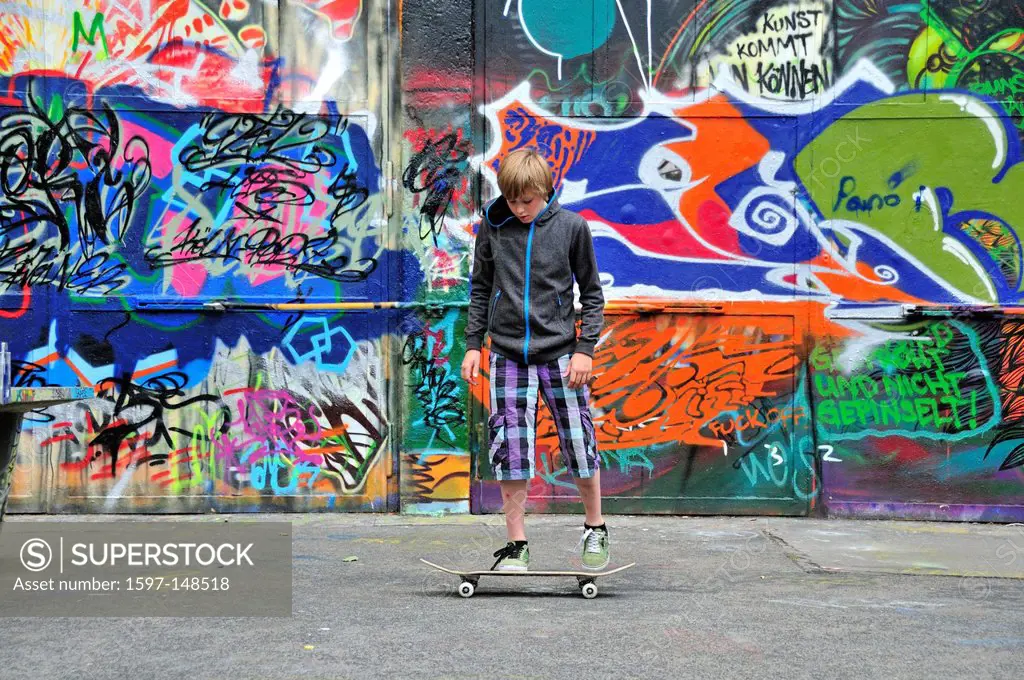 Boy, Germany, 11, Europe, leisure activity, graffiti, wall, youth culture, boy, kid, child, Cologne, model release, Nordrhein, skateboard, Skater, spo...