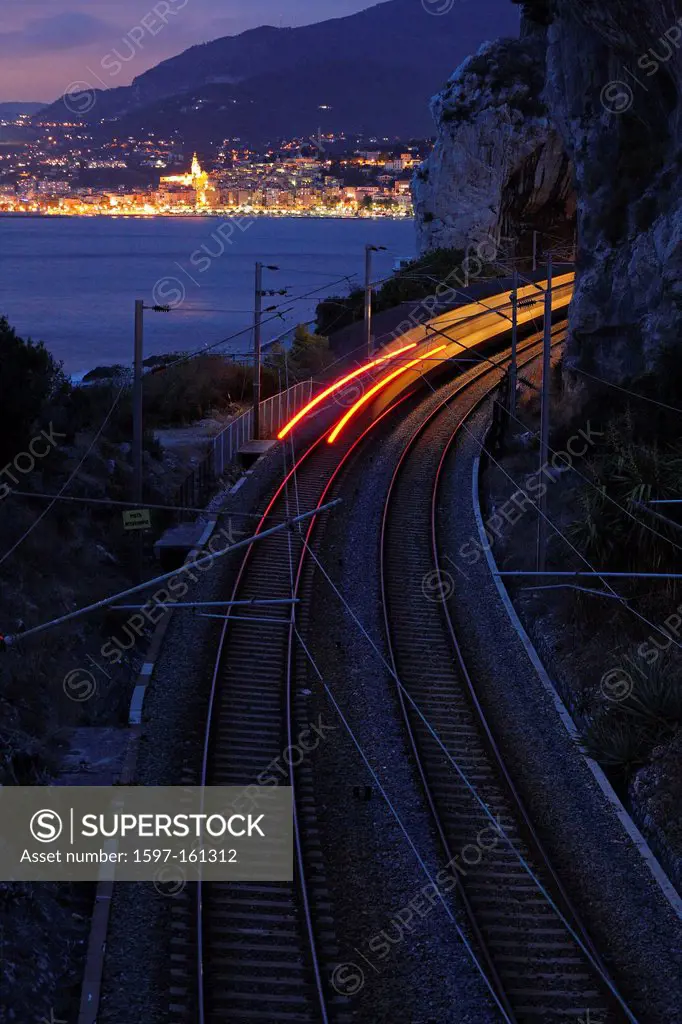 Italy, Europe, Liguria, Imperia, Capo Mortola, Balzi Rossi, railroad, train, rails, traffic, at night, evening, Menton, lights