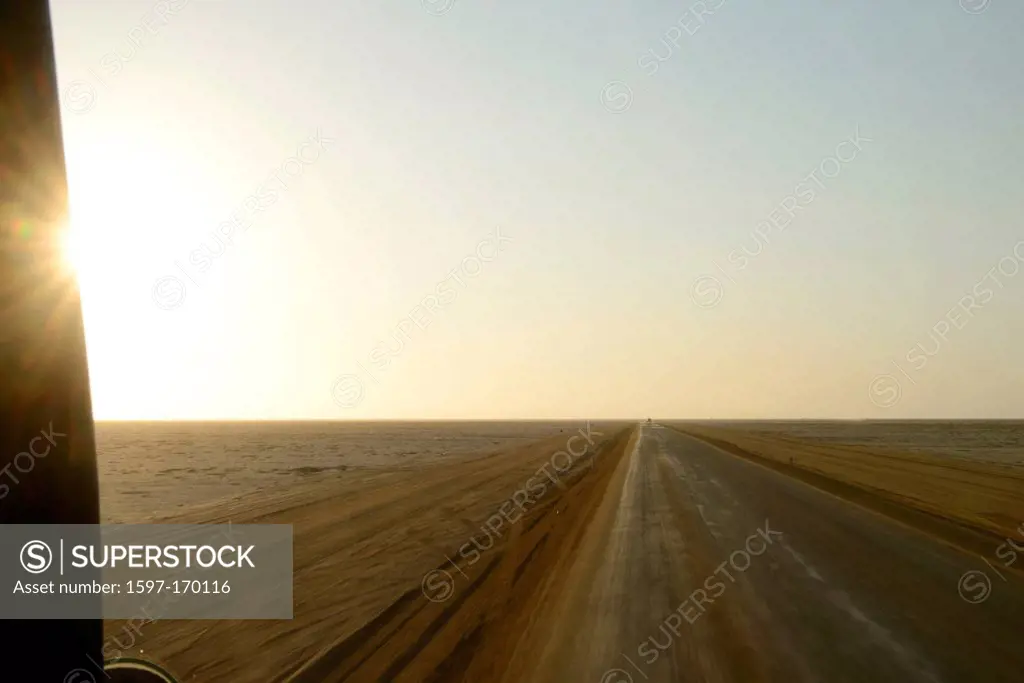 Africa, Henties Bay, Namibia, Skeleton Coast, desert, dirt road, dusk, horizontal, landscape, light burst, street, sunburst, sunset