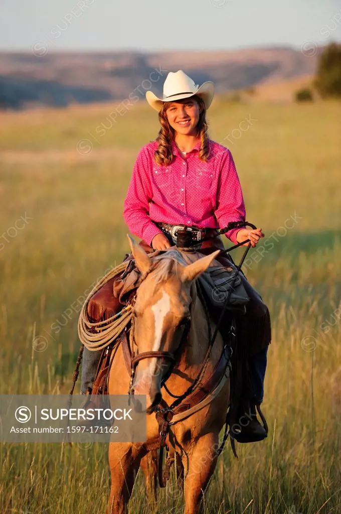 American west, Pacific Northwest, Oregon, USA, United States, America, cowgirl, girl, woman, riding, horseback, sport, horse, ranch, hat