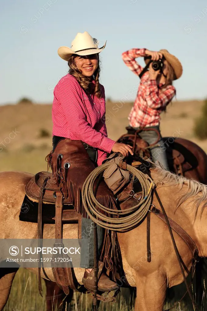 American West, Pacific Northwest, Oregon, USA, United States, America, cowgirl, girl, woman, riding, horseback, sport, horse, ranch, hat, photography