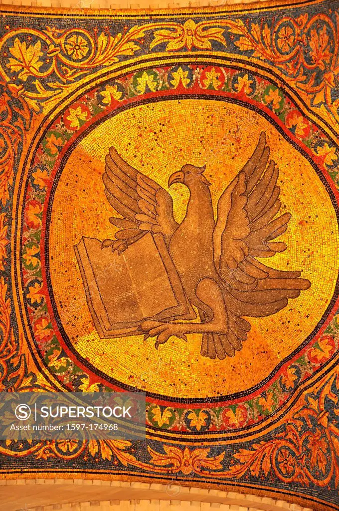 Magnificent golden mosaic of an eagle with bible, symbolising the evangelist John from the basilica of St Mark, Venice, Italy