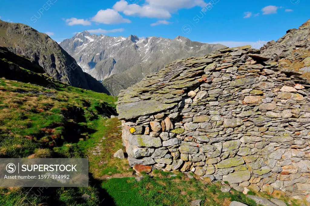 an old shepherd´s hut high in the mountains with stone walls and roof and a great view