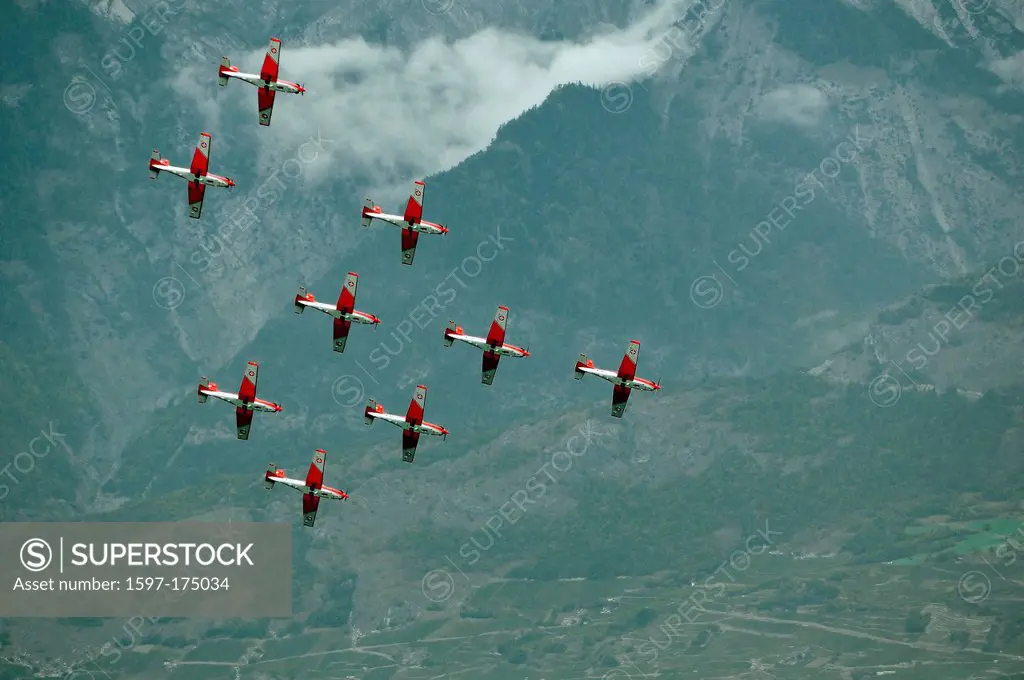SION, SWITZERLAND, Swiss air force PC_7 team in formation at the Breitling Air show. September 17, 2011 in Sion, Switzerland