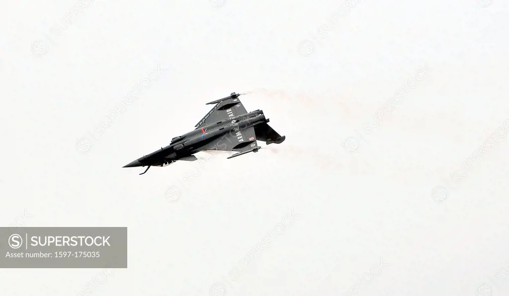 SION, SWITZERLAND, Dassault Rafale looping the loop at the Breitling Air show. September 17, 2011 in Sion, Switzerland