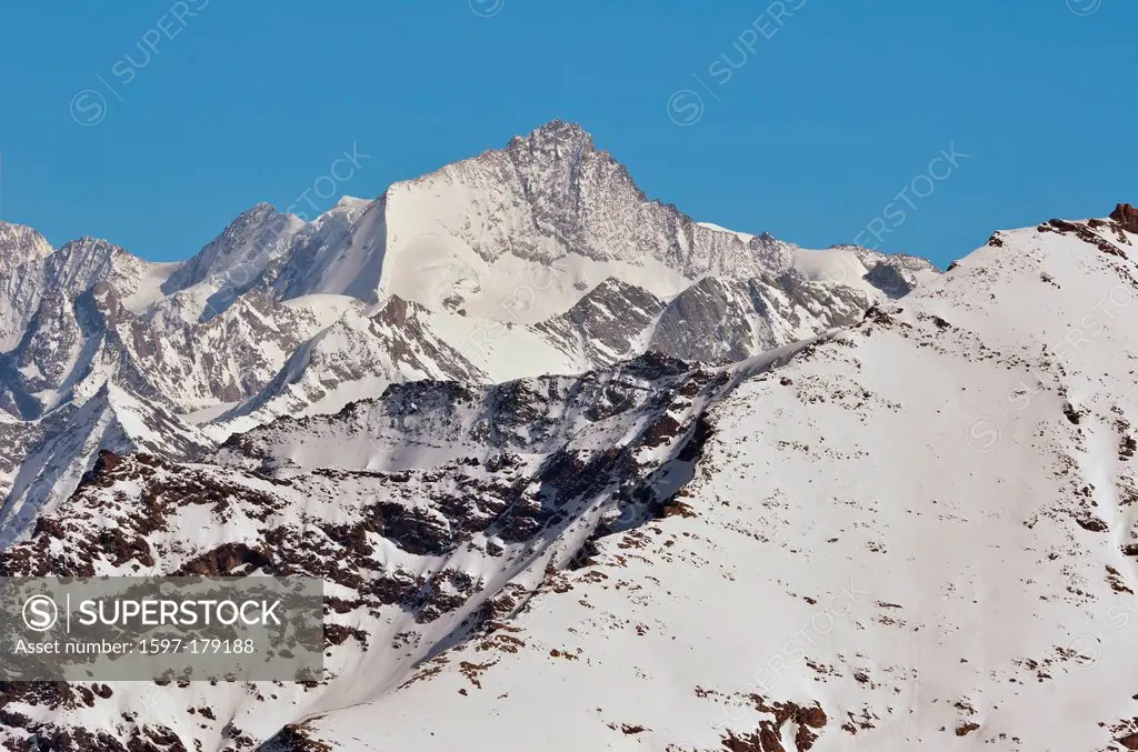 the summit and west face of the Zinal rothorn above the mountain resort of Zinal in the southern swiss alps