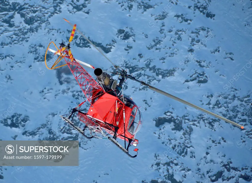 tail end view of a helicopter adapted for operating at high altitude. Seen here descending from the high mountainst after performing a rescue