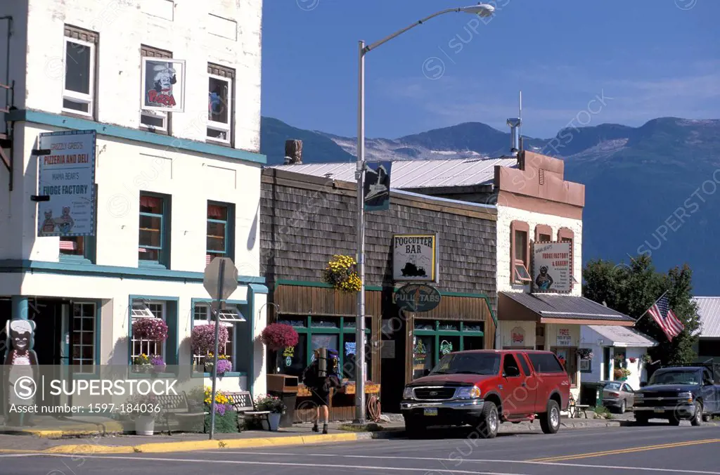 Haines, Alaska, USA, small town, old buildings, sunny, parked cars, flowers in pots, bar, blue sky