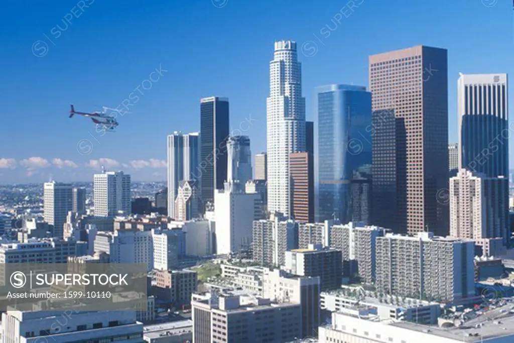 Helicopter flies over new Los Angeles skyline, Los Angeles, California