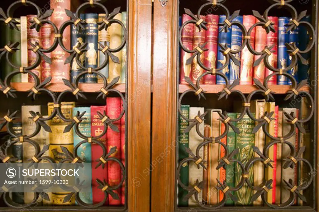 Antique books in Gothic library shelves at Hearst Castle, San Simeon, Central California Coast