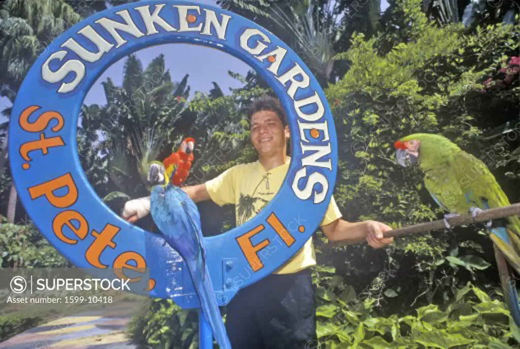 Parrots and trainer at the Sunken Gardens, Florida's foremost botanical gardens, St. Petersburg, Florida
