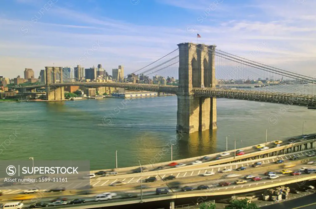 Long view of Brooklyn Bridge over East River to Brooklyn with FDR River, NY