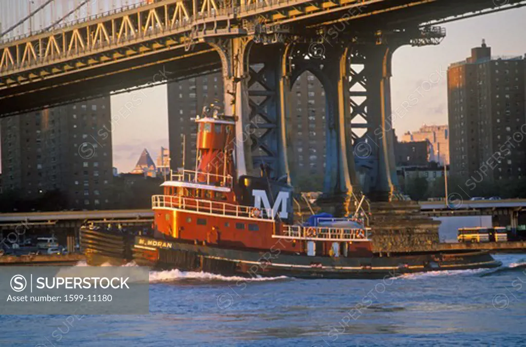 Tug boat under Brooklyn Bridge, New York NY