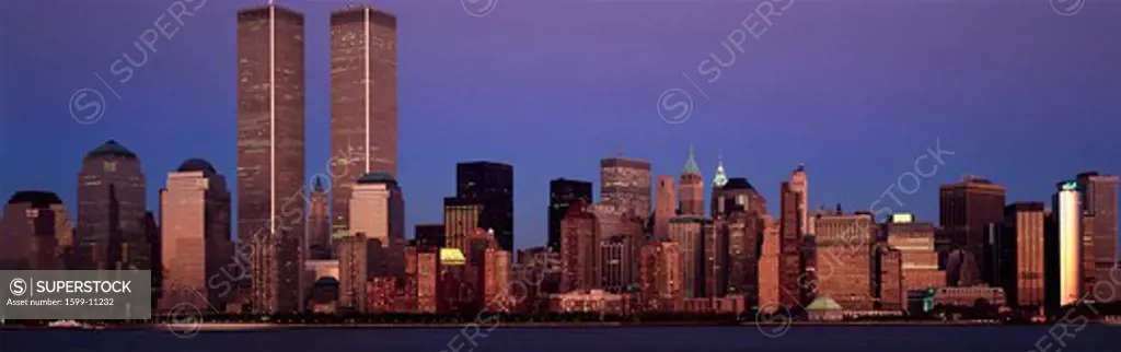 Panoramic view of lower Manhattan and New York City skyline, NY with World Trade Towers at sunset