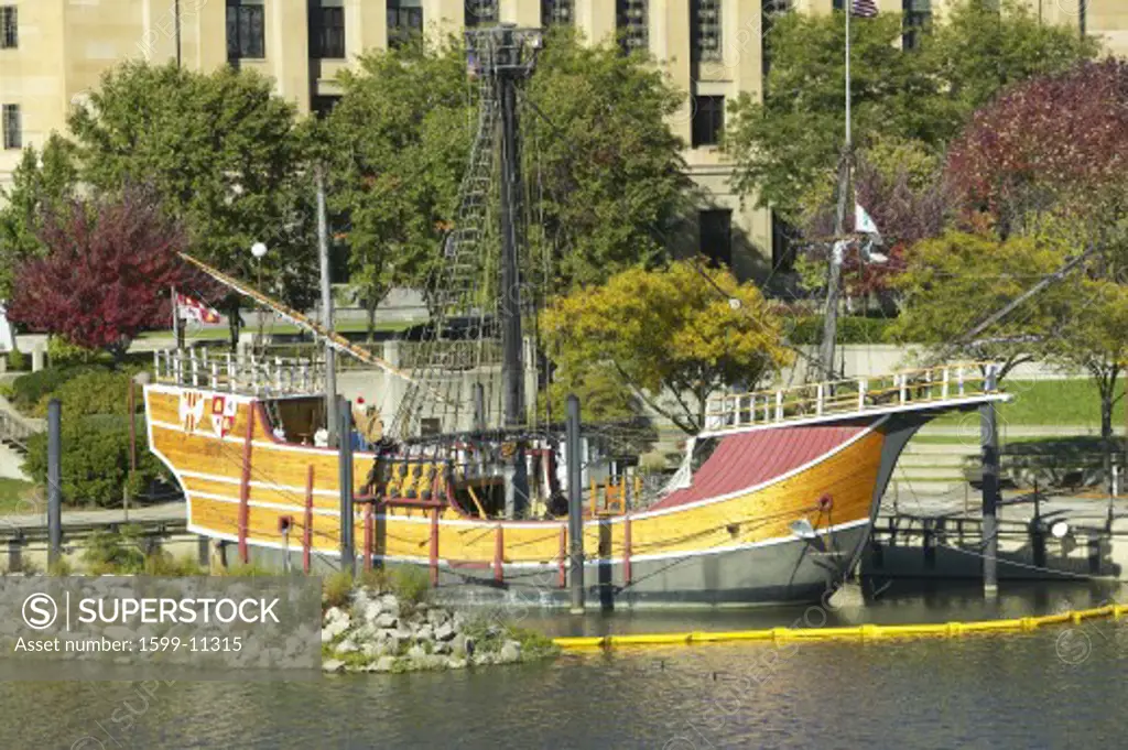 Replica of Columbus' ship the Santa Maria on Scioto River, Columbus Ohio skyline in autumn