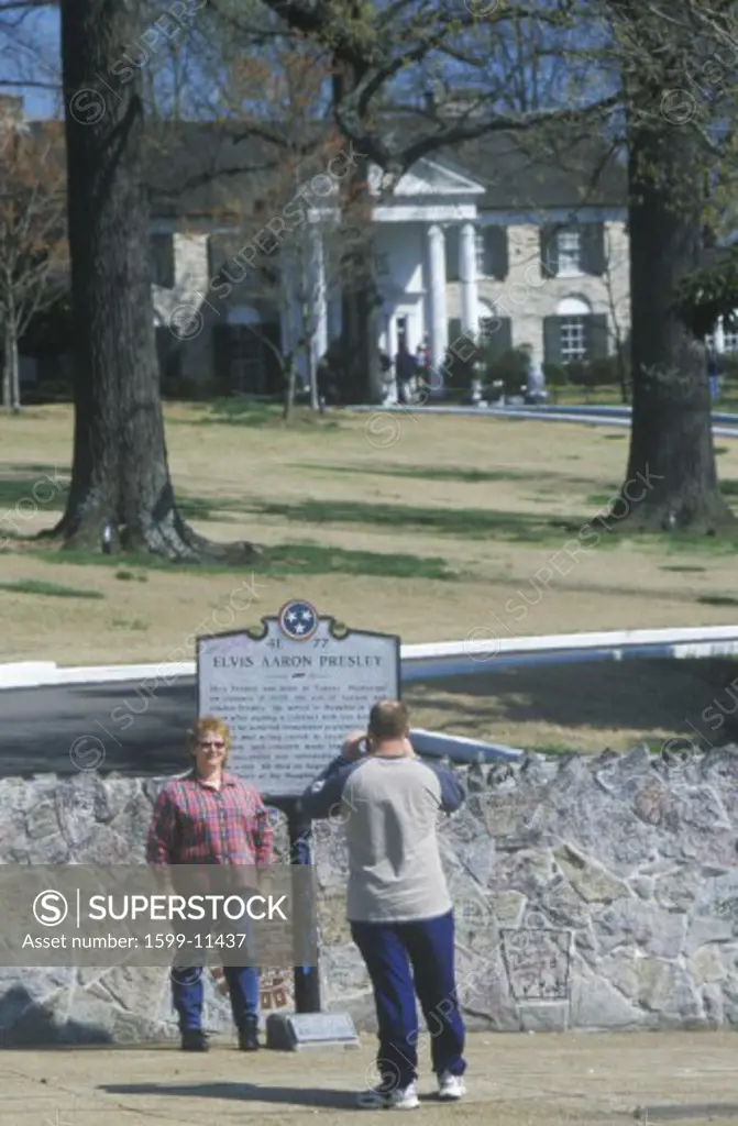 Tourists taking souvenir photos outside of 'Graceland', home of Elvis Presley, Memphis, TN