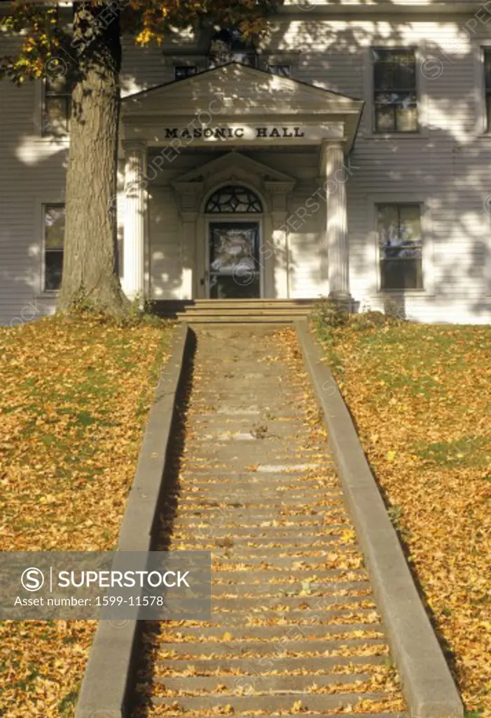 Leaf covered steps in fall in Windsor, VT