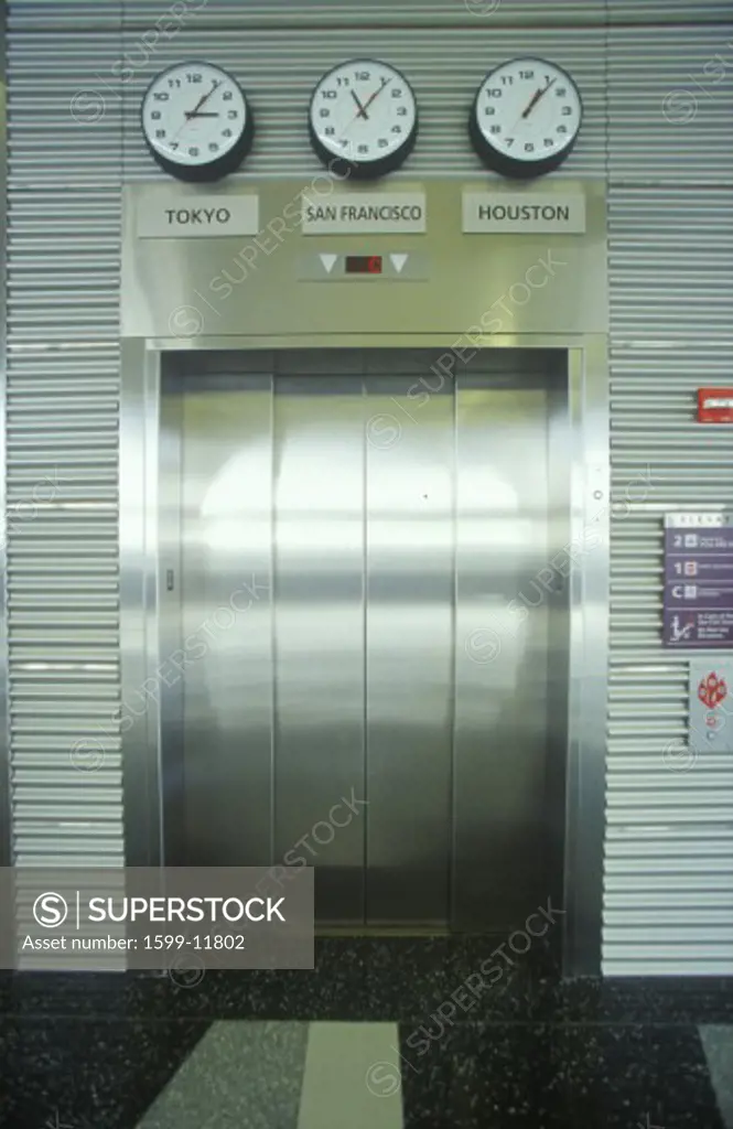 Chrome elevator doors & world time zones, Cleveland International Airport