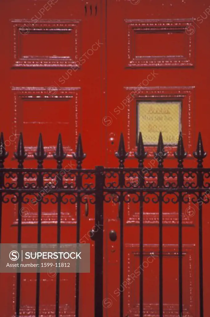Red door and wrought iron gate at a West Village Boarding School, NY