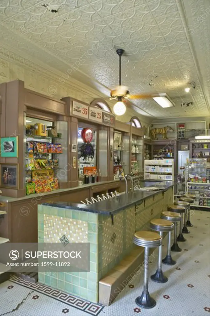 Interior of old drug store with bar stools and soda fountain in French Quarter of New Orleans LA