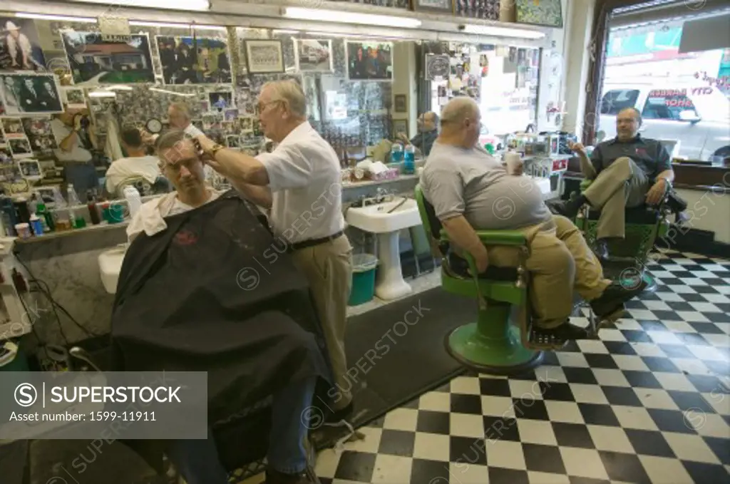 Floyd cutting hair at Floyd's City Barber Shop in Mount Airy, North Carolina, the town featured in Mayberry RFD” and home of Andy Griffith