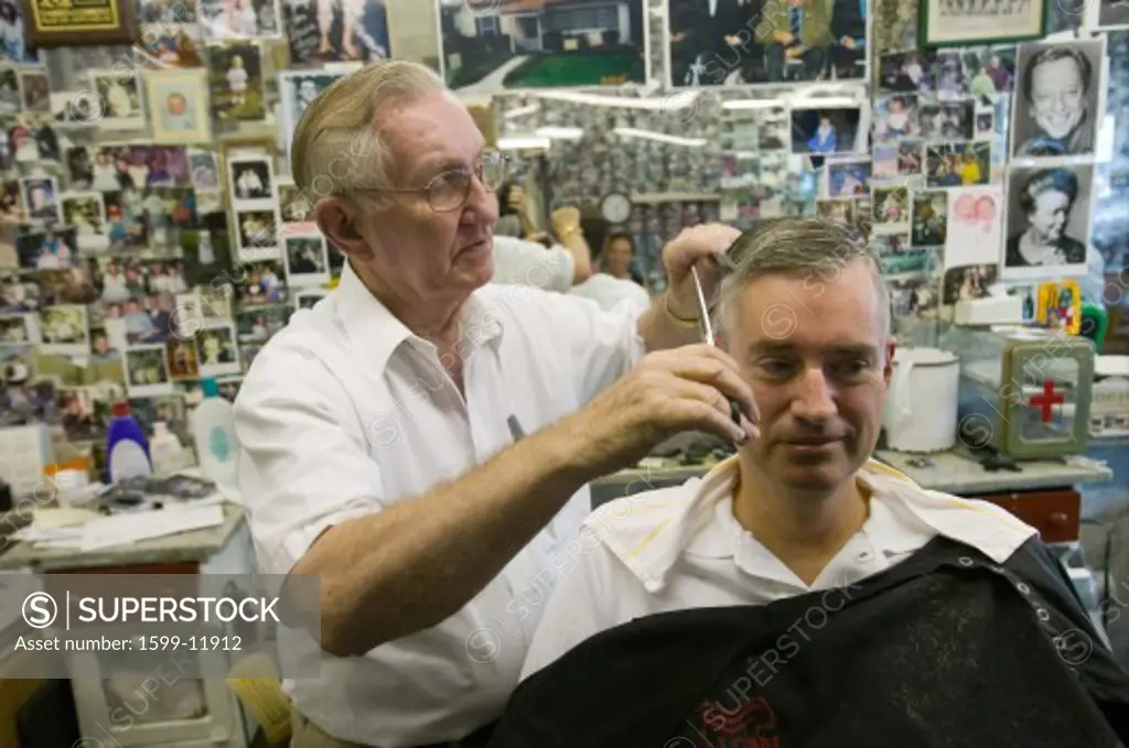 Floyd cutting hair at Floyd's City Barber Shop in Mount Airy, North Carolina, the town featured in Mayberry RFD” and home of Andy Griffith