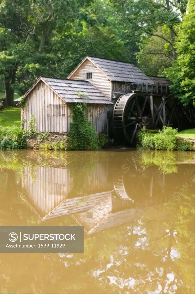 Historic Edwin B. Mabry Grist Mill (Mabry Mill) in rural Virginia on Blue Ridge Parkway and reflection on pond in summer