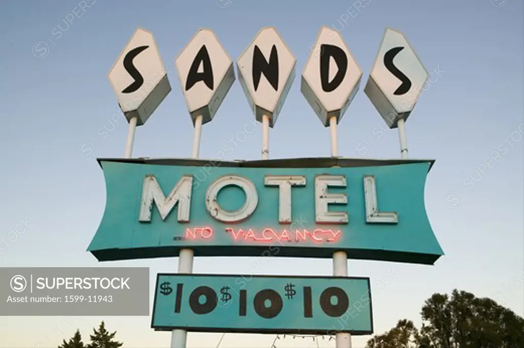 Neon lights come on at sunset at Sands Motel with RV Parking for $10, located at the intersection of Route 54 & 380 in Carrizozo, New Mexico