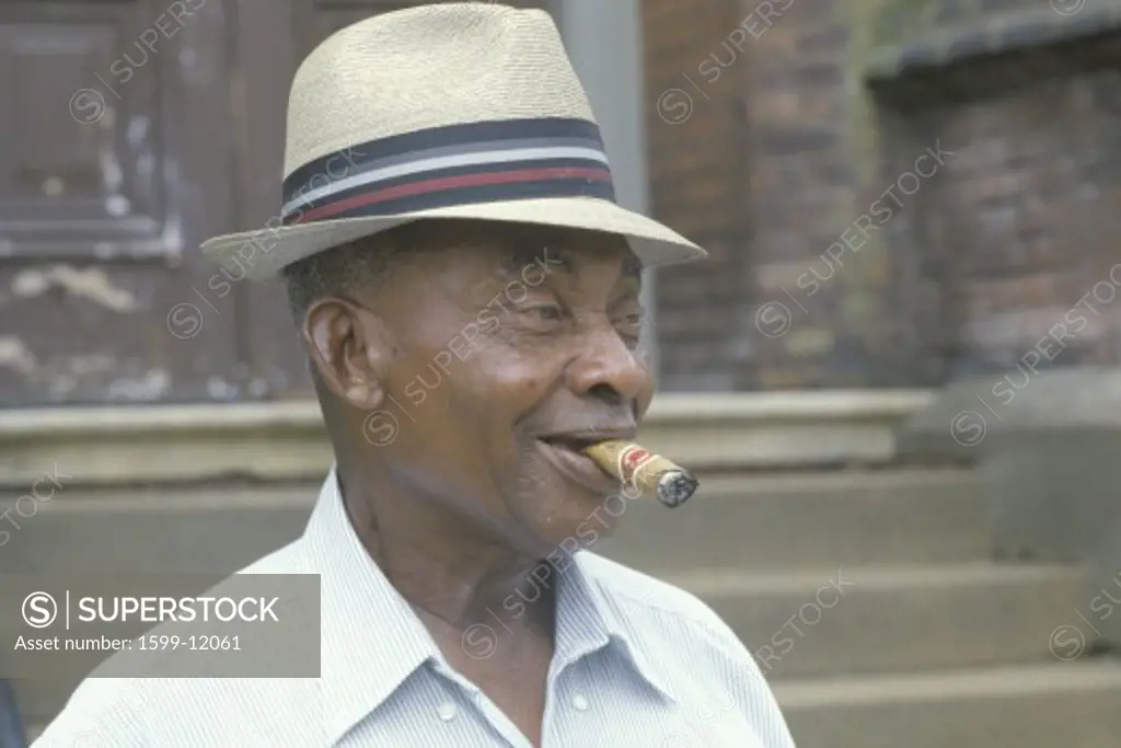 An African-American man smoking a cigar, Vicksburg, MS