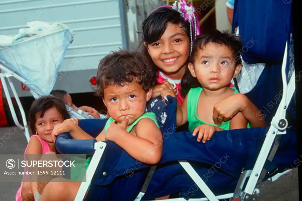 Mexican American children in a stroller, Los Angeles, CA