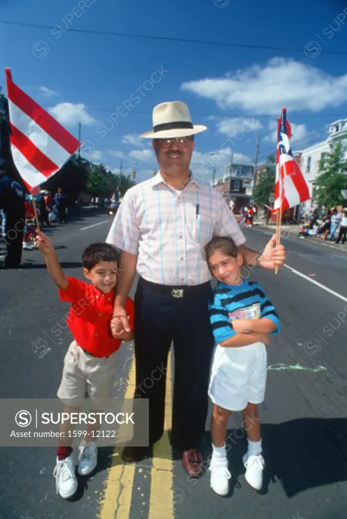 A Puerto Rican father with his sons at the Puerto Rican Festival, Wilmington, DE