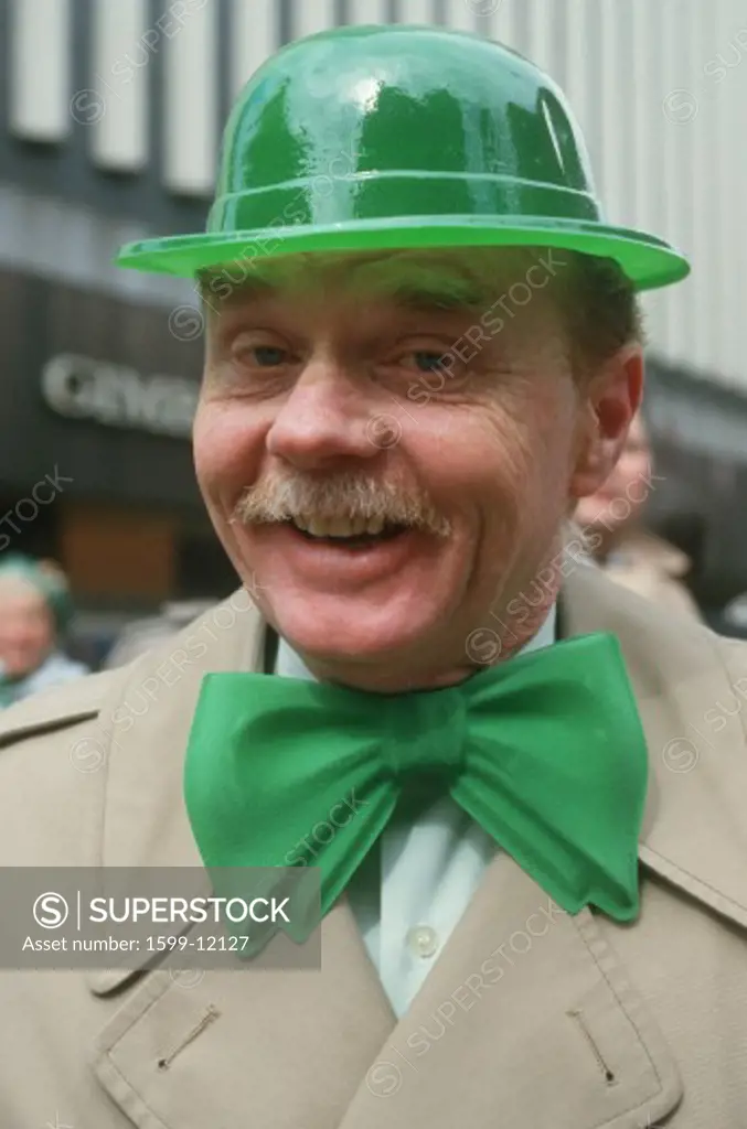 A man dressed in green derby and bow-tie for the St. Patrick's Day Parade, NY City