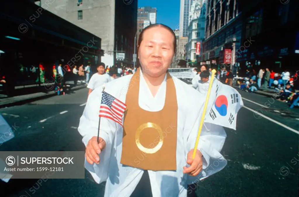 Man marching at the Korean Day Parade on lower Broadway, NY City 