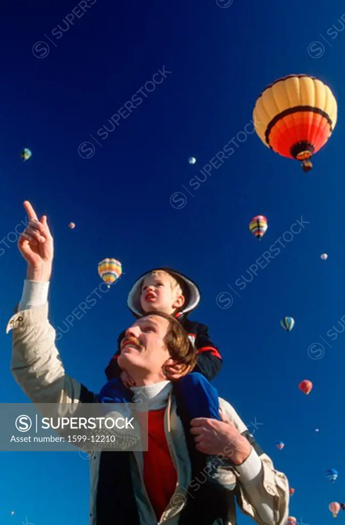 A father and son enjoying the Albaquerque Hot Air Ballon Festival, NM