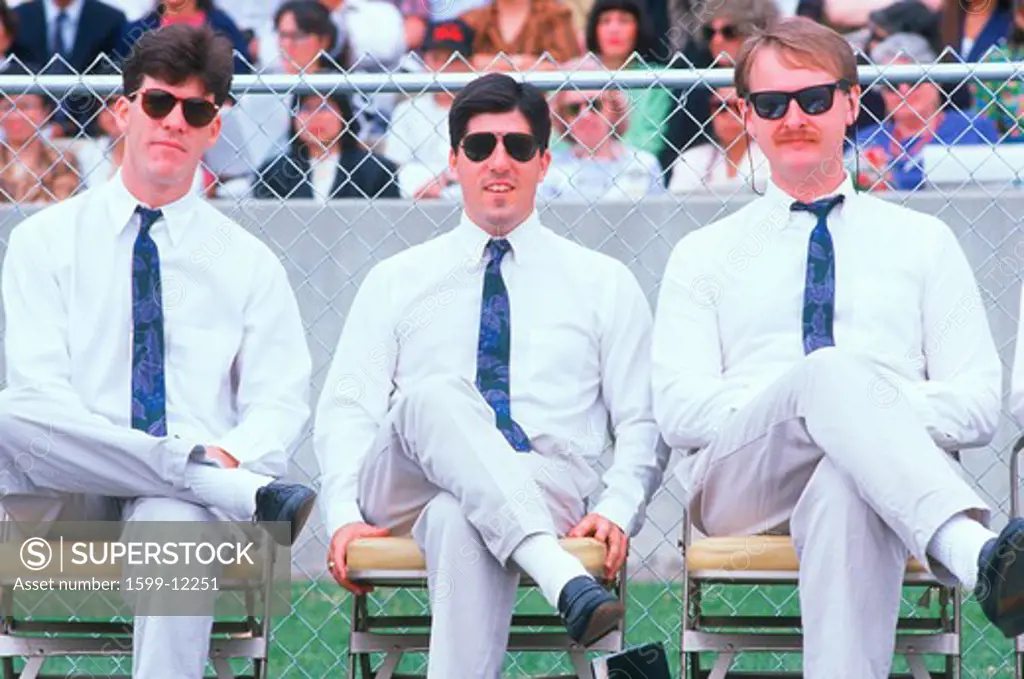 Three men wearing uniforms at a college event, University CA Los Angeles, CA