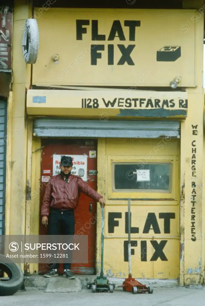 A repairman at a tire shop, South Bronx, NY City