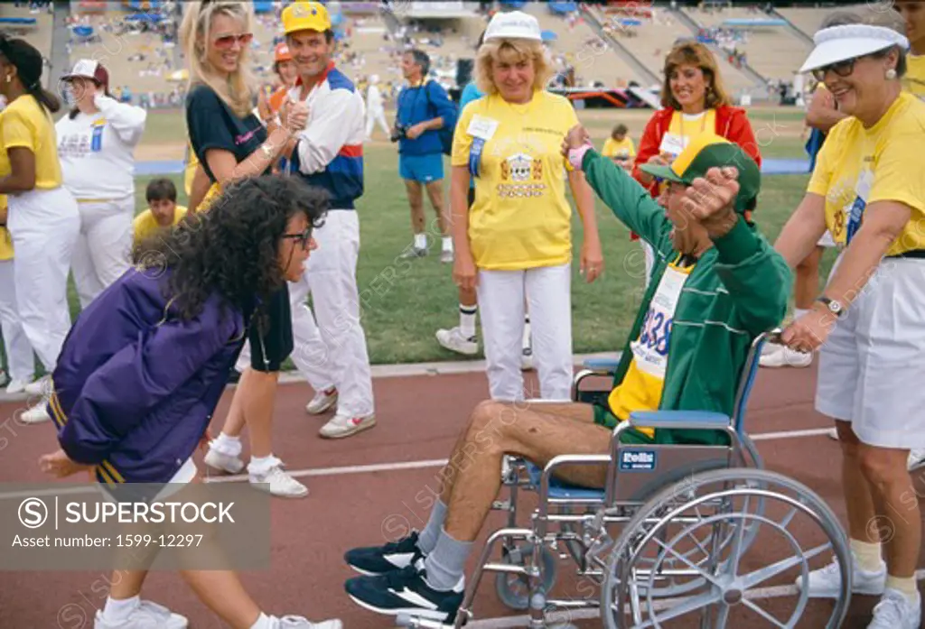 A man in a wheelchair competes at the Special Olympics, 