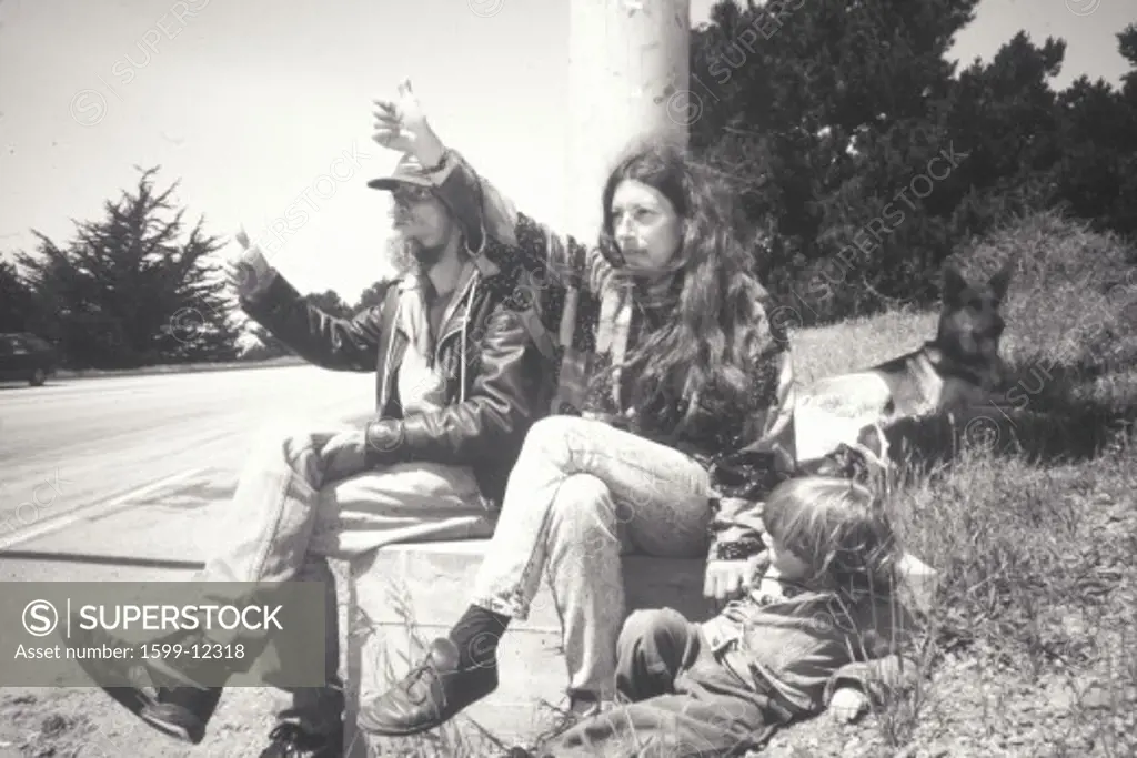 A hippie family hitchhiking on Highway 1, Big Sur, CA