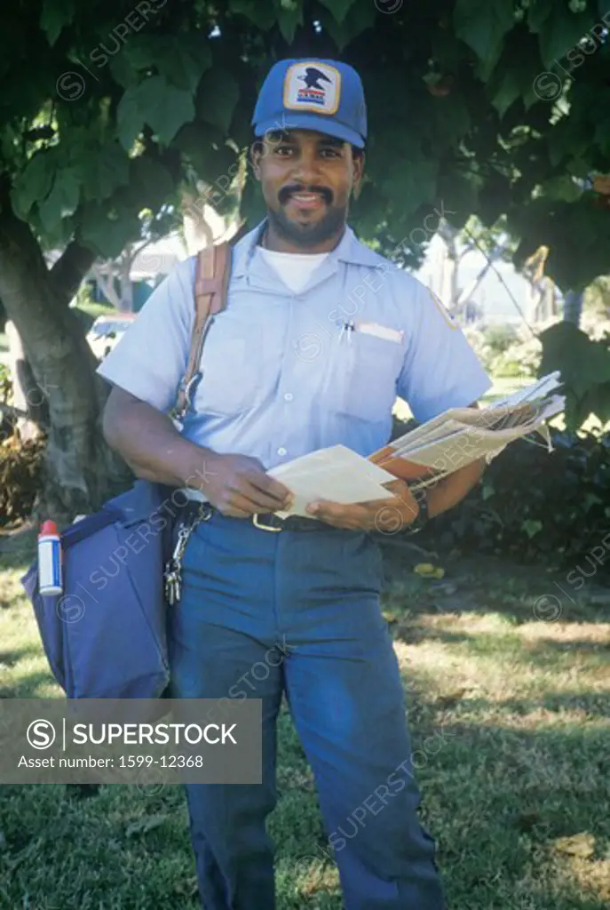 An African-American mail carrier on his route, Santa Monica, CA