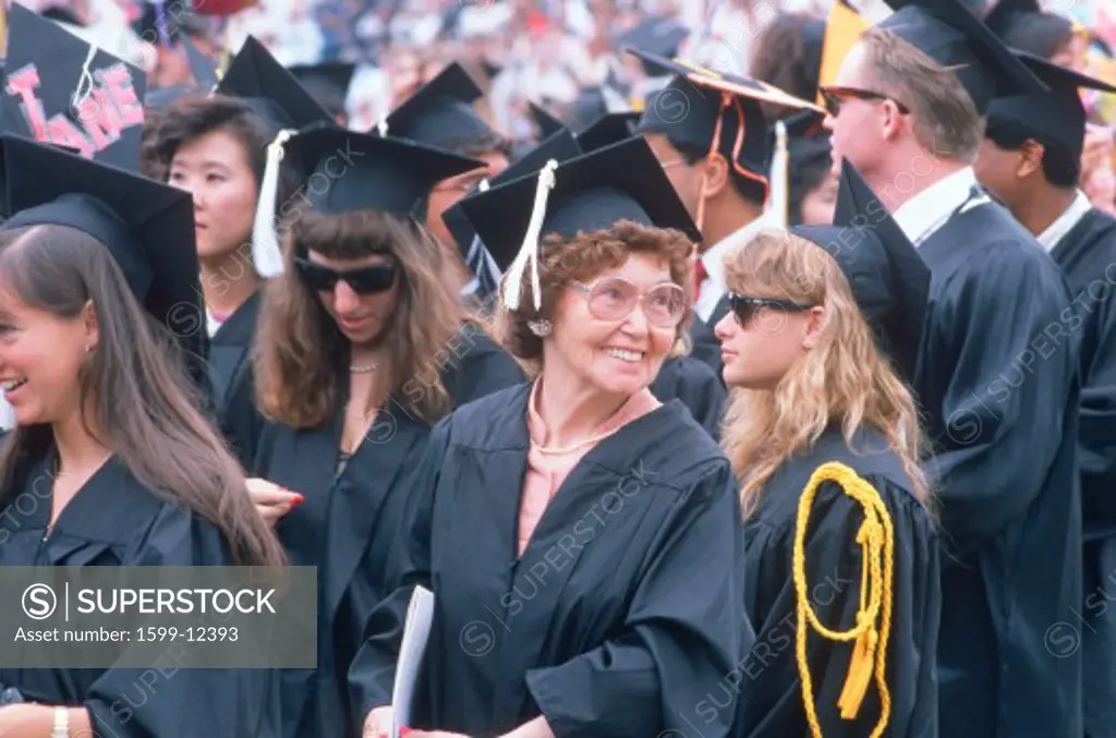 An older graduate smiles at her ceremony from UCLA, Los Angeles, CA