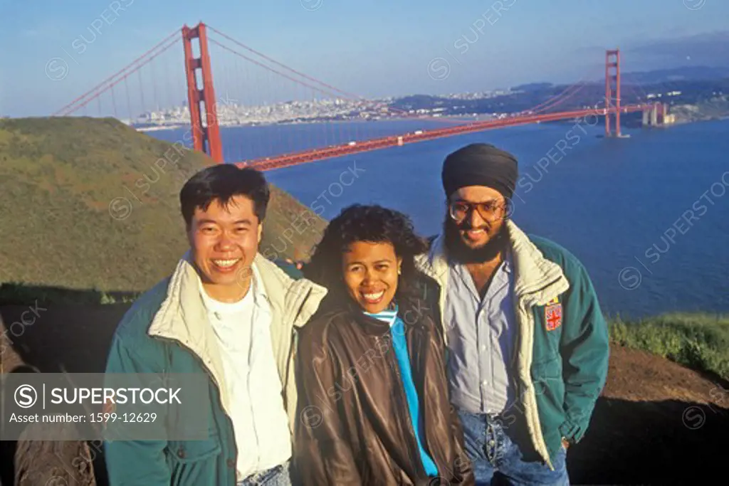 Malaysian tourists posing in front of Golden Gate Bridge, San Francisco, CA