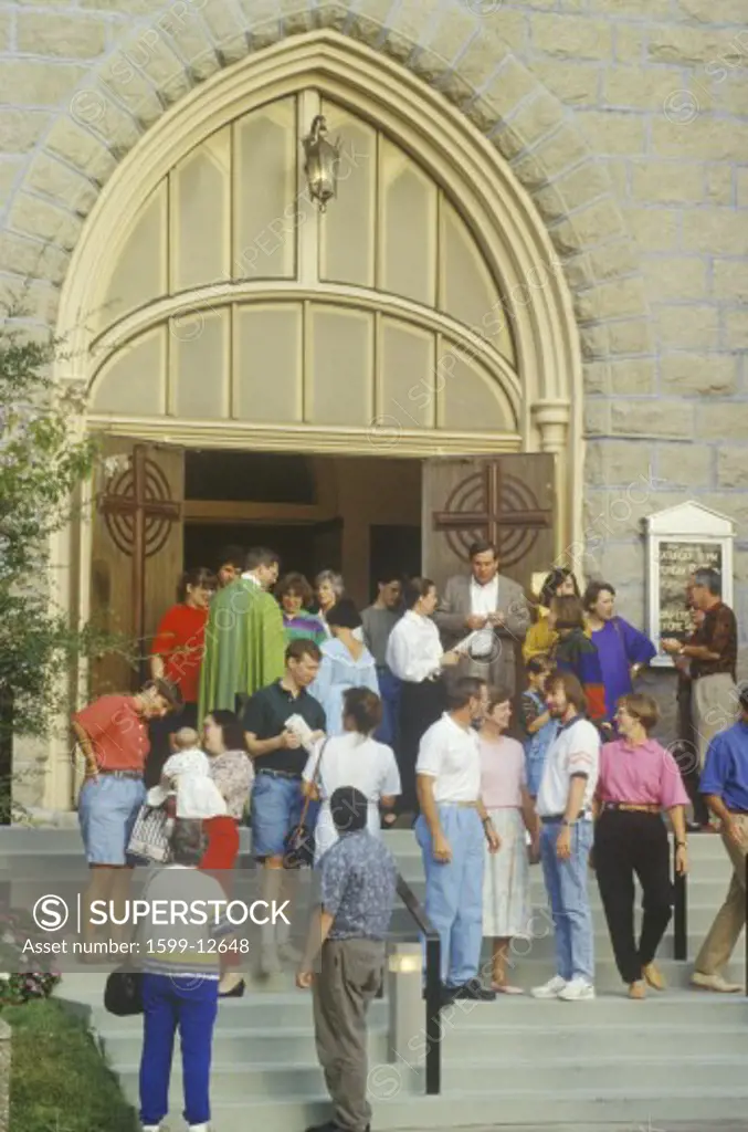 Churchgoers at fellowship outside of Catholic church after Mass, Little Rock, AR 