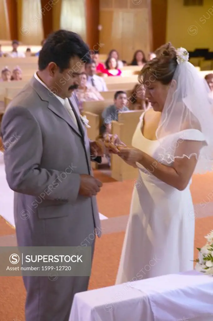 Latino-American exchange wedding rings at St. Thomas Catholic Church in Ojai, California