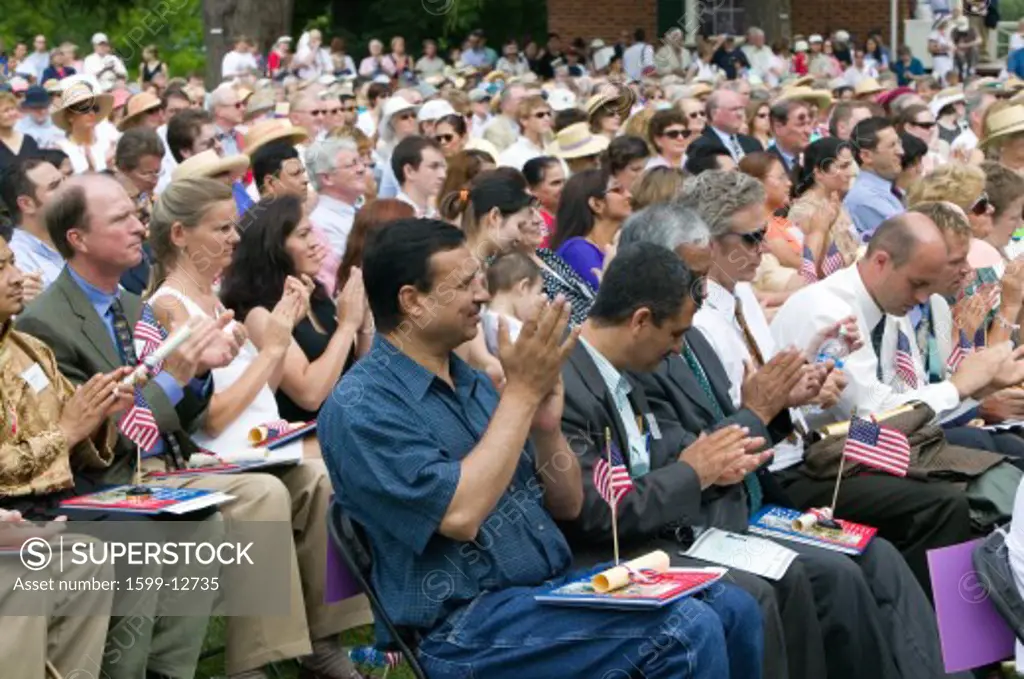 Iraq immigrant applauding with 76 new American citizens at Independence Day Naturalization Ceremony on July 4, 2005 at Thomas Jefferson's home, Monticello, Charlottesville, Virginia, on the anniversary of Jefferson's death day and the signing of the Declaration of Independence