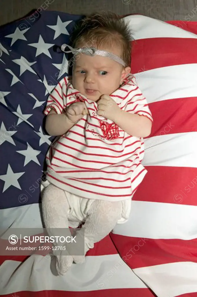 Newborn baby (Sophia Larson) wrapped in American flag was born on October 16th, the birthday of the 300 Millionth American, Ventura, California