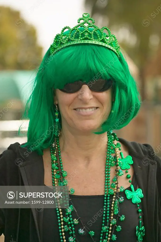 St. Patty's Day, a woman smiles dressed in green for St. Patrick's Day in Santa Barbara, California