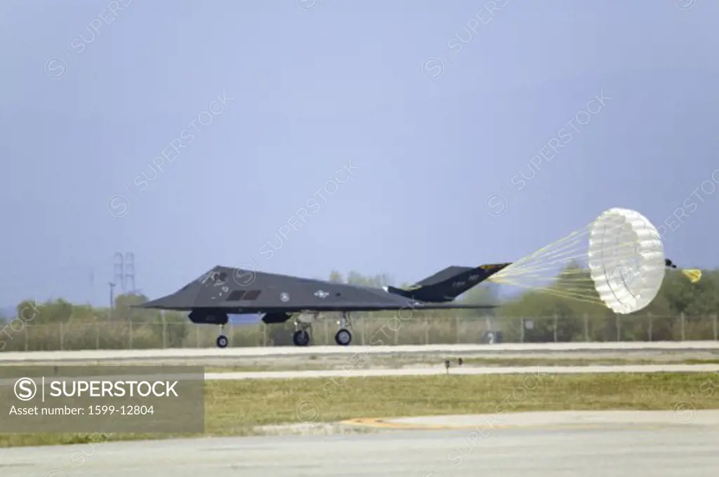 F-117A Nighthawk Stealth Jet Fighter landing with parachute opening at the 42nd Naval Base Ventura County (NBVC) Air Show at Point Mugu, Ventura County, Southern California.
